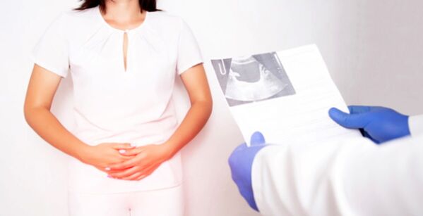 Woman with bacterial cystitis being diagnosed by a doctor